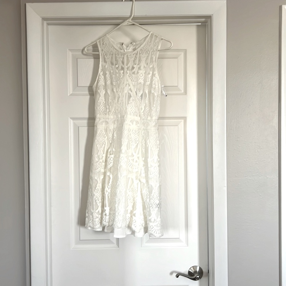 White lace Adelyn Rae dress.